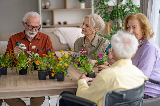 istock Seniors Gathered Around a Table for Gardening Fun 2211451285