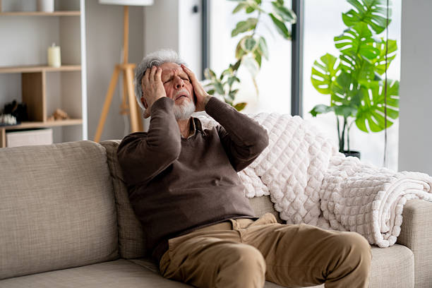 istock Senior man showing distress with hand on heart 2211451390