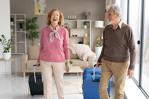 istock Joyful couple with luggage preparing for their next adventure 2211451395
