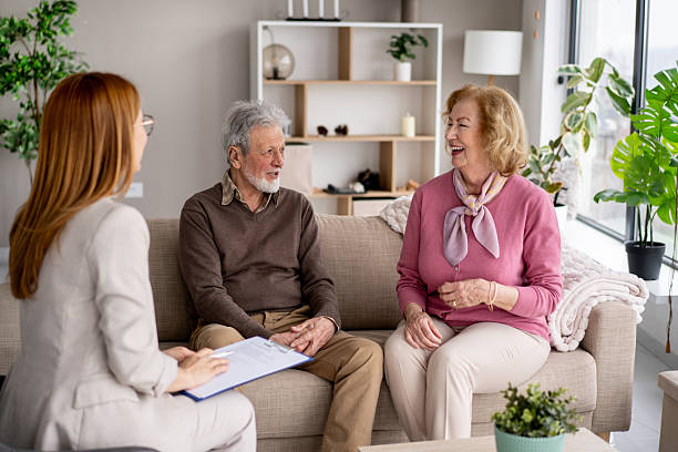 istock Elderly couple sharing laughter in a cozy setting 2211451412