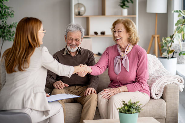 istock Professional Discusses with Couple, Engaging with Laptop 2211451418