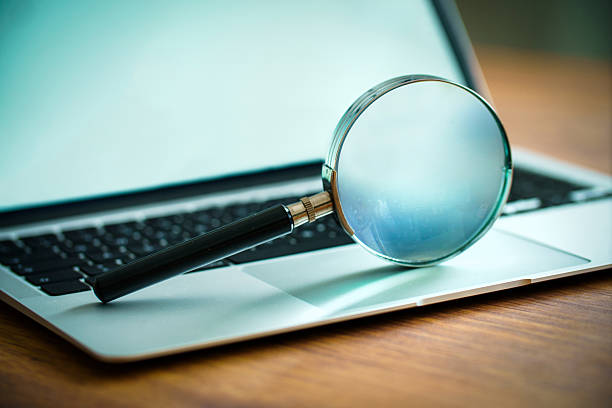istock Magnifying Glass on Laptop 2211451689