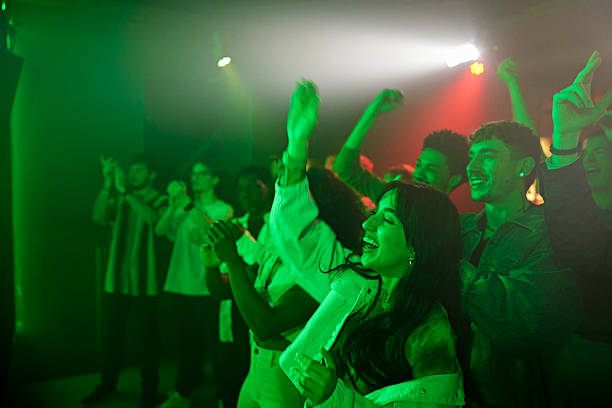 istock Excited fans applauding nightclub performance 2211454273
