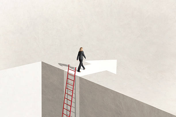 istock Woman Using Ladder To Reach Her Goal 2211455919