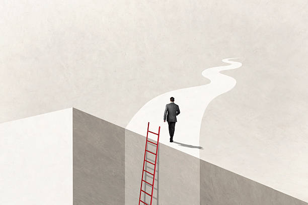 istock Man Uses Ladder To Reach His Goal 2211455921