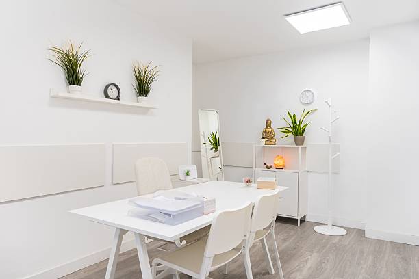 istock Modern psychologist office decorated with buddha figurine and plants. 2211458624