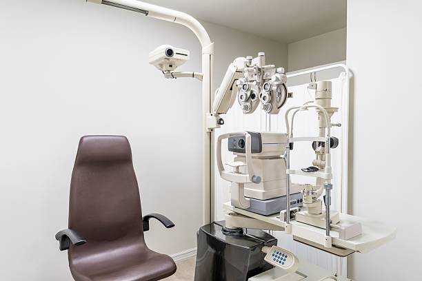 istock Optometry examination room with ophthalmic equipment. 2211458850