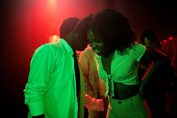 istock Young nightclubbers meeting, smiling, interacting 2211459878