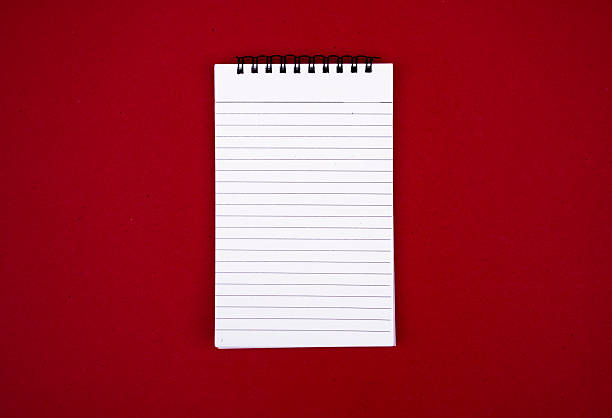 Blank Journal on Red Tabletop Ideal for Office or Study Themes