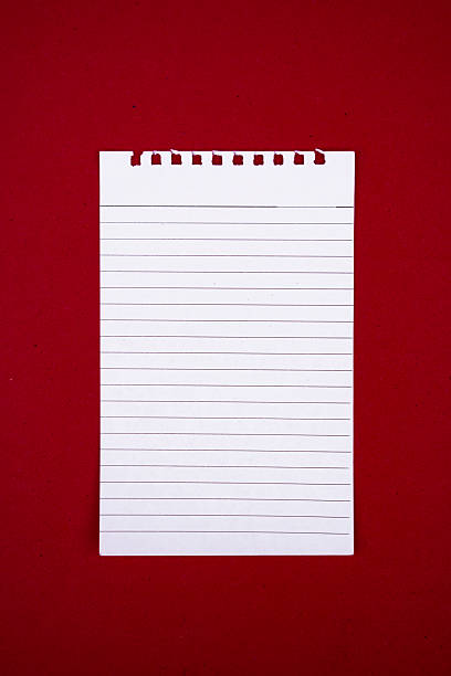istock Top View of Blank Notebook page Isolated on Red Background for Notes 2211467581