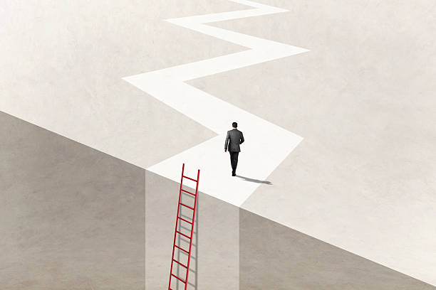 istock Man Uses Ladder To Reach His Goal 2211468197
