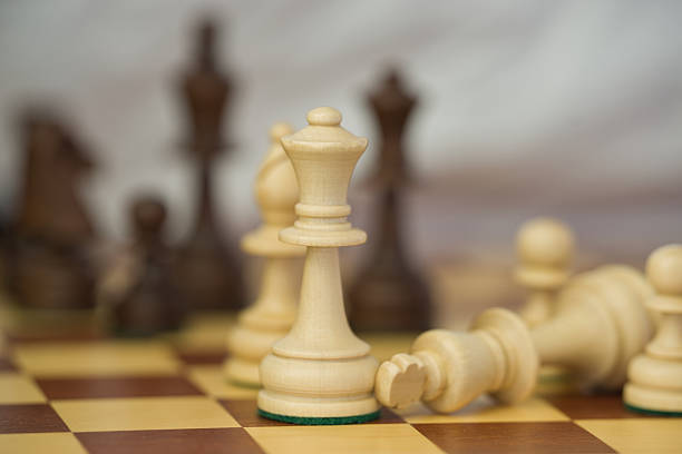 istock chess game, white and black figures and pawns on the chessboard, gameplay 2211468646