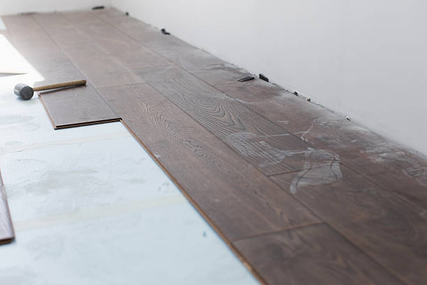 istock Laying laminate. Covering floor with parquet 2211469748