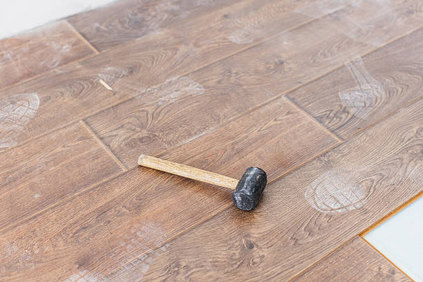 istock Laying laminate. Covering floor with parquet 2211469751