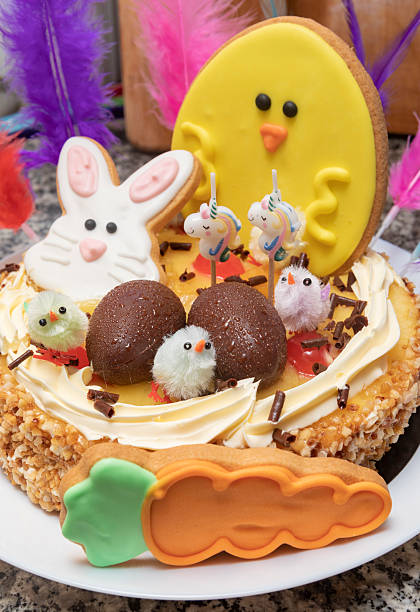 istock Easter cake, tiny cute chocolate eggs and candied fruits, and cookies 2211470551