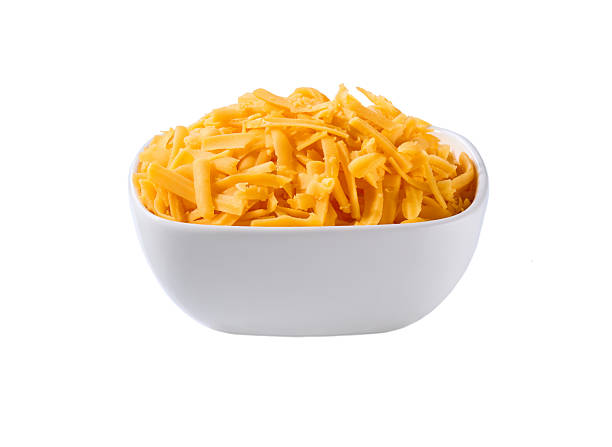 istock white ceramic bowl with shredded cheddar cheese isolated on a white background. 2211471099