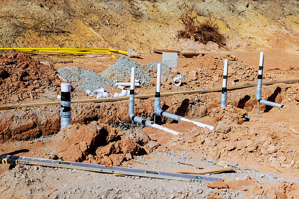 istock Construction site with newly installed plumbing pipes and excavation work in progress 2211475387