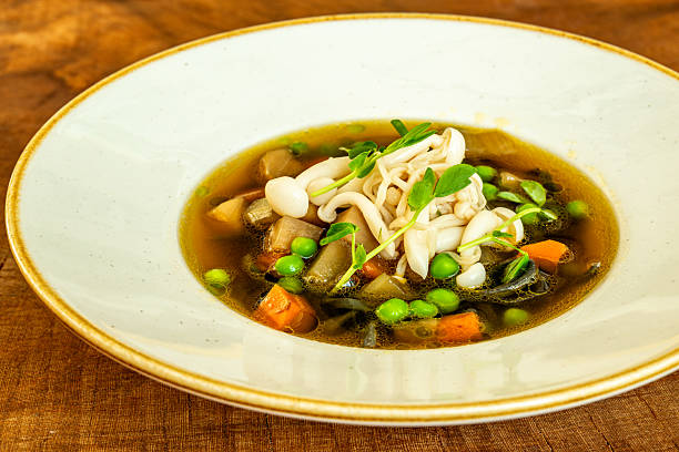 istock Vegetable soup with mushrooms and fresh peas 2211478444