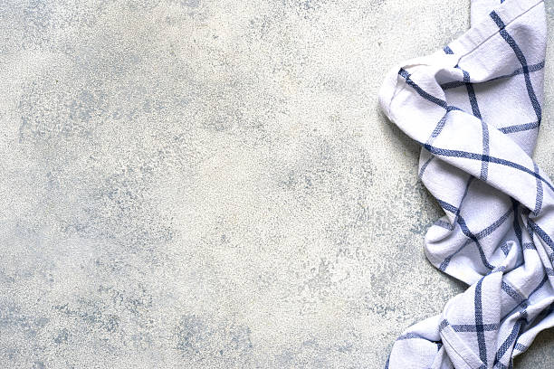 istock Slate, stone or concrete table with kitchen towel.Culinary background. 2211479736