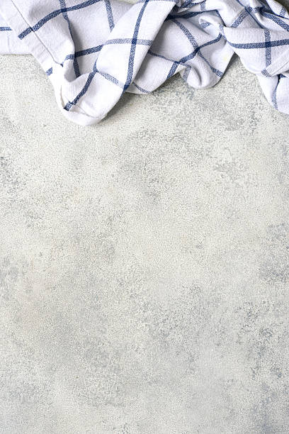 istock Slate, stone or concrete table with kitchen towel.Culinary background. 2211479827