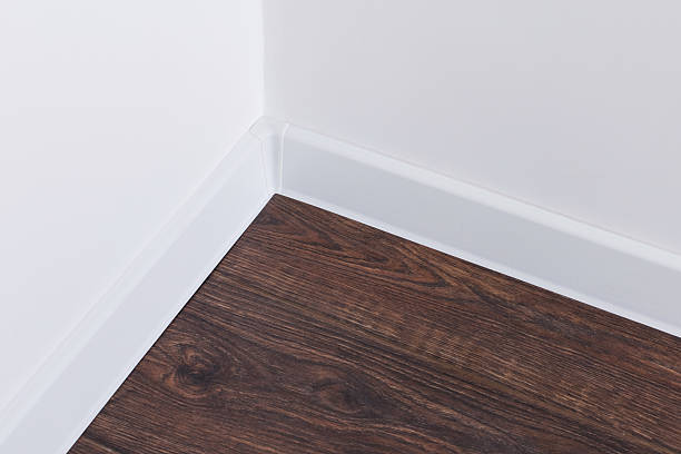 istock Baseboard. White wall. Parquet. Corner of room 2211487013