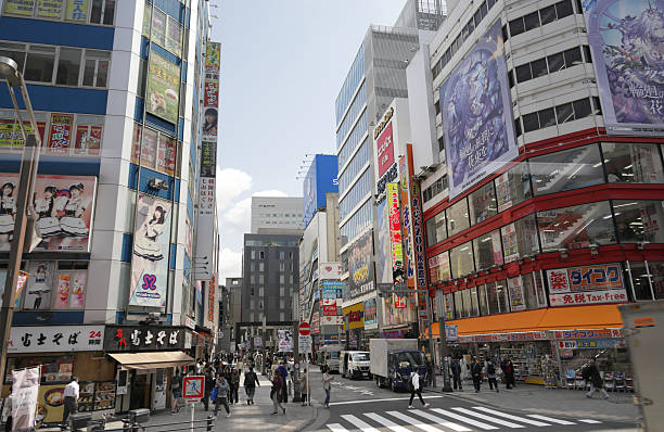Chiyoda City, Japan - April 7, 2025: Looking toward the JR Akihabara Station, South Exit in Sotokanda district. Brilliant commercial signs line this district famous for manga, anime and electronics. Spring morning in the Tokyo Metropolis.