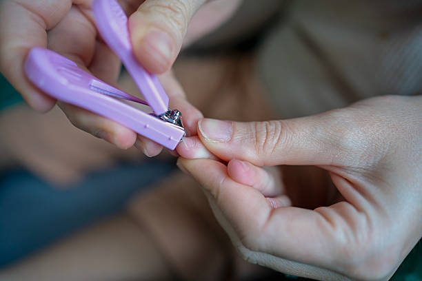 cut your toenails with nail scissors at home. Foot and nail care