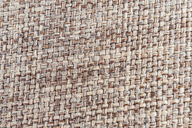 istock Close-up image of textured fabric, woven material with visible threads and a distinctive pattern, soft yet firm texture, suggesting durability and quality, could be used in marketing materials for cl 2211490601
