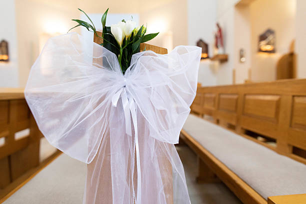 istock Elegant Wedding Decoration Featuring Beautiful White Flowers in a Charming Church Setting 2211490613