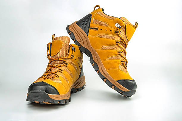 istock Image of practical hiking boots, designed for rough terrains with a robust tread pattern and muted color Used in outdoor adventurer marketing campaigns 2211490726