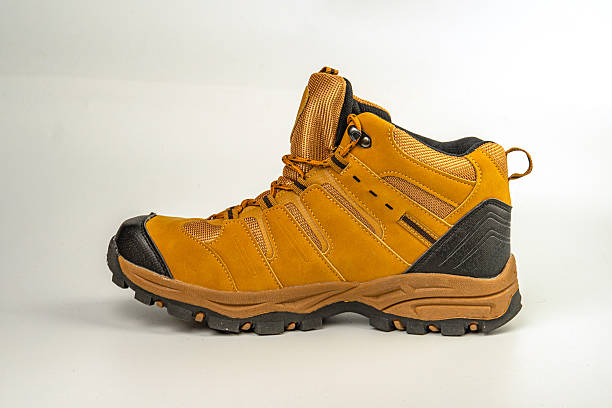 istock A lace-up hiking boot with sturdy construction, water resistance, and a brown color scheme for outdoor terrains 2211490814