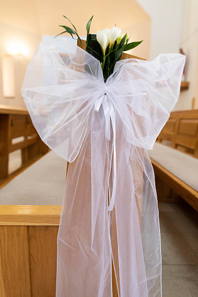 istock Stunning and Elegant Wedding Decoration Featuring Delicate White Ribbon Alongside Beautiful Flowers 2211490878
