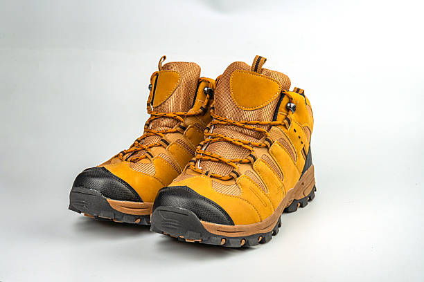 istock A focused image of rugged hiking boots, showcasing adjustable fit and ankle support with thick soles for grip Earthy tone color scheme implies durability for various terrains, appealing to adventure 2211491090