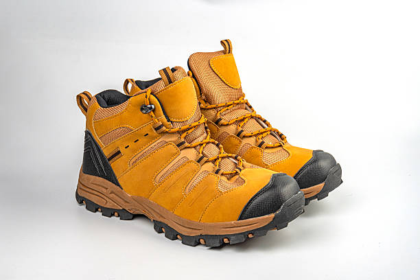 istock Ankle-high hiking boot displayed on a neutral background, robust sole, waterproof material, suitable for outdoor activities like hiking or trekking 2211491097