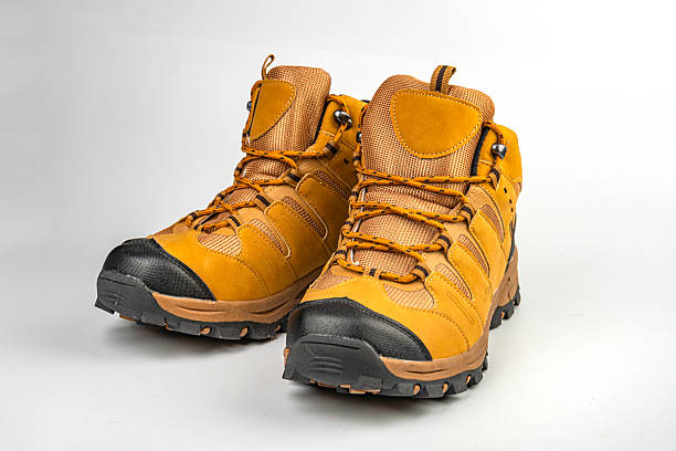 istock Image shows durable hiking boots with a lace-up design, suitable for rugged terrains The boots have traction patterns on the soles for grip and an earthy color scheme 2211491106