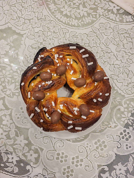 istock Traditional Sweet Easter Bread with Chocolate Eggs and Sugar Crystals 2211492771