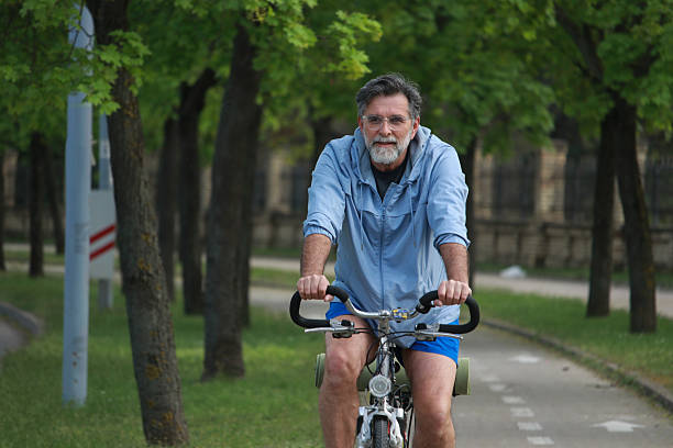 istock Senior bearded man ride bicycle and enjoy 2211493779