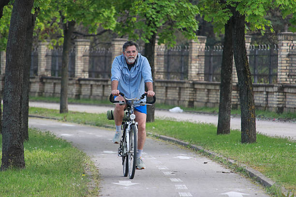 istock Senior bearded man ride bicycle and enjoy 2211493804