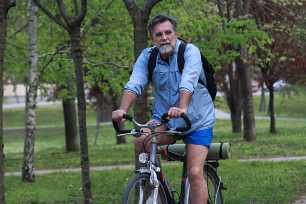 istock Senior bearded man ride bicycle and enjoy 2211493818