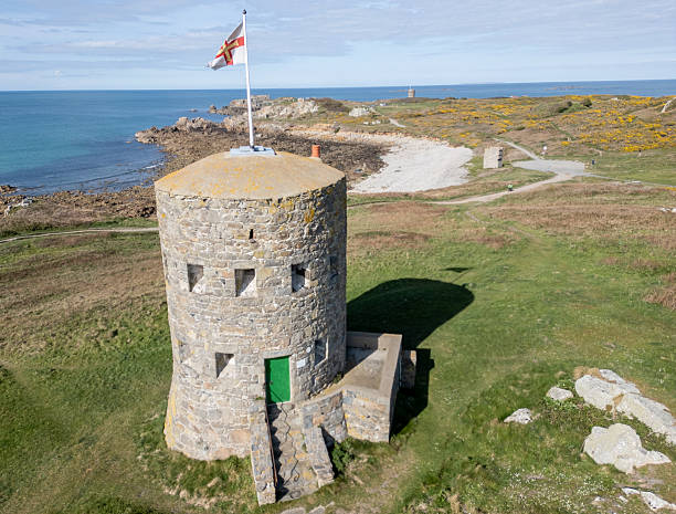 istock Loophole Tower No.5 L'Ancresse with Guernsey flag 2211499480