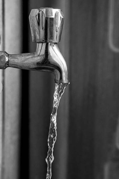 istock Close-Up of Silver Tap with Running Water 2211501359