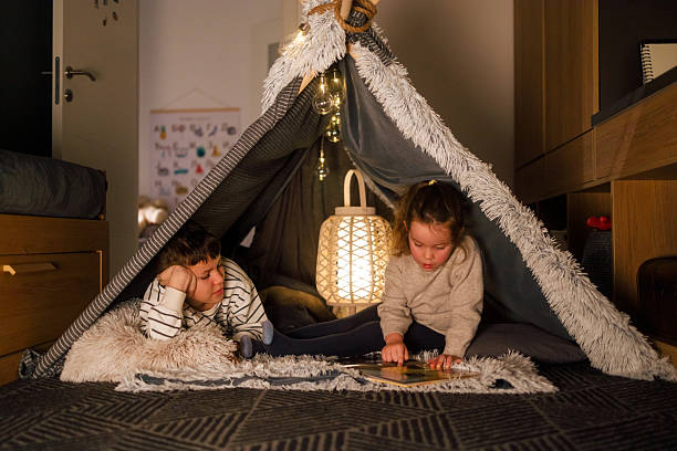 istock Sibling Bonding Time in a Cozy Blanket Fort 2211508069