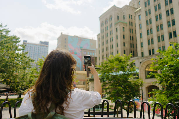 istock Woman using smartphone in Montreal, Canada 2211508869