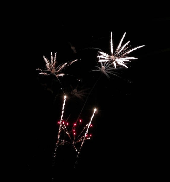 istock Vibrant fireworks explode against a deep black night sky.  Represents celebration, excitement, and new beginnings. Ideal for event promotions and festive designs. 2211509220
