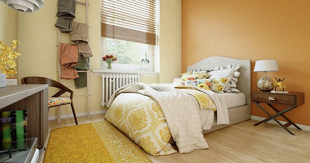 istock Sunlit Yellow Bedroom with Cozy Bedding 2211509700