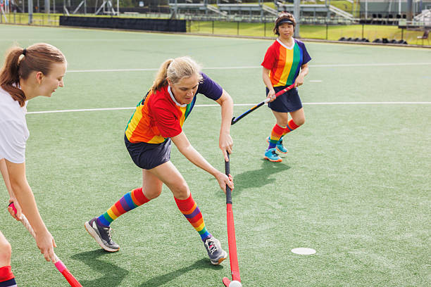 istock Female field hockey player in action 2211509900