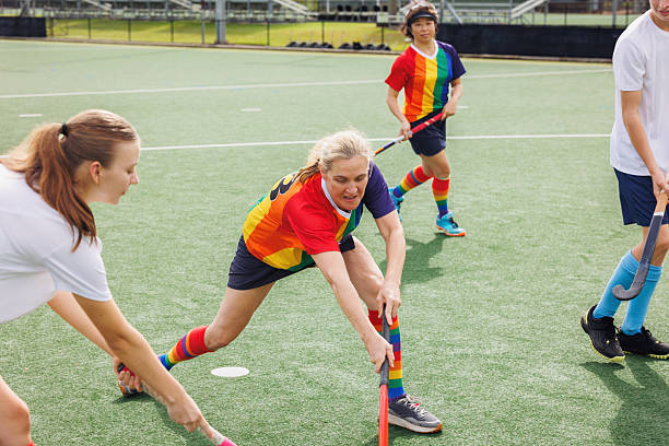 istock Female field hockey player in action 2211509901