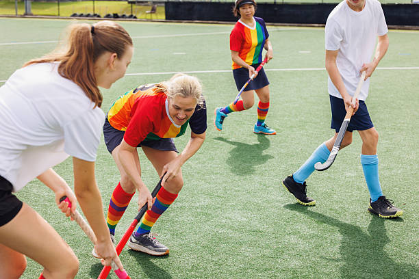 istock Female field hockey player in action 2211509902