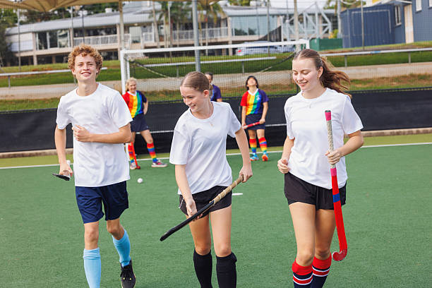 istock Junior hockey players celebrate scoring a goal 2211509967