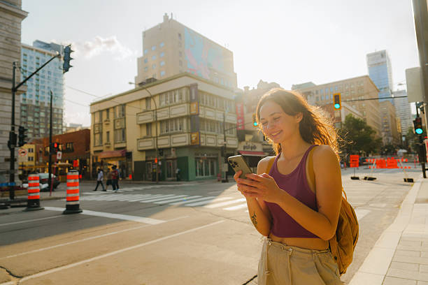 istock Woman using smartphone in Montreal, Canada 2211510041